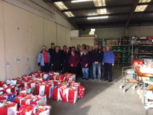 Volunteers making Christmas parcels for Foodbank clients